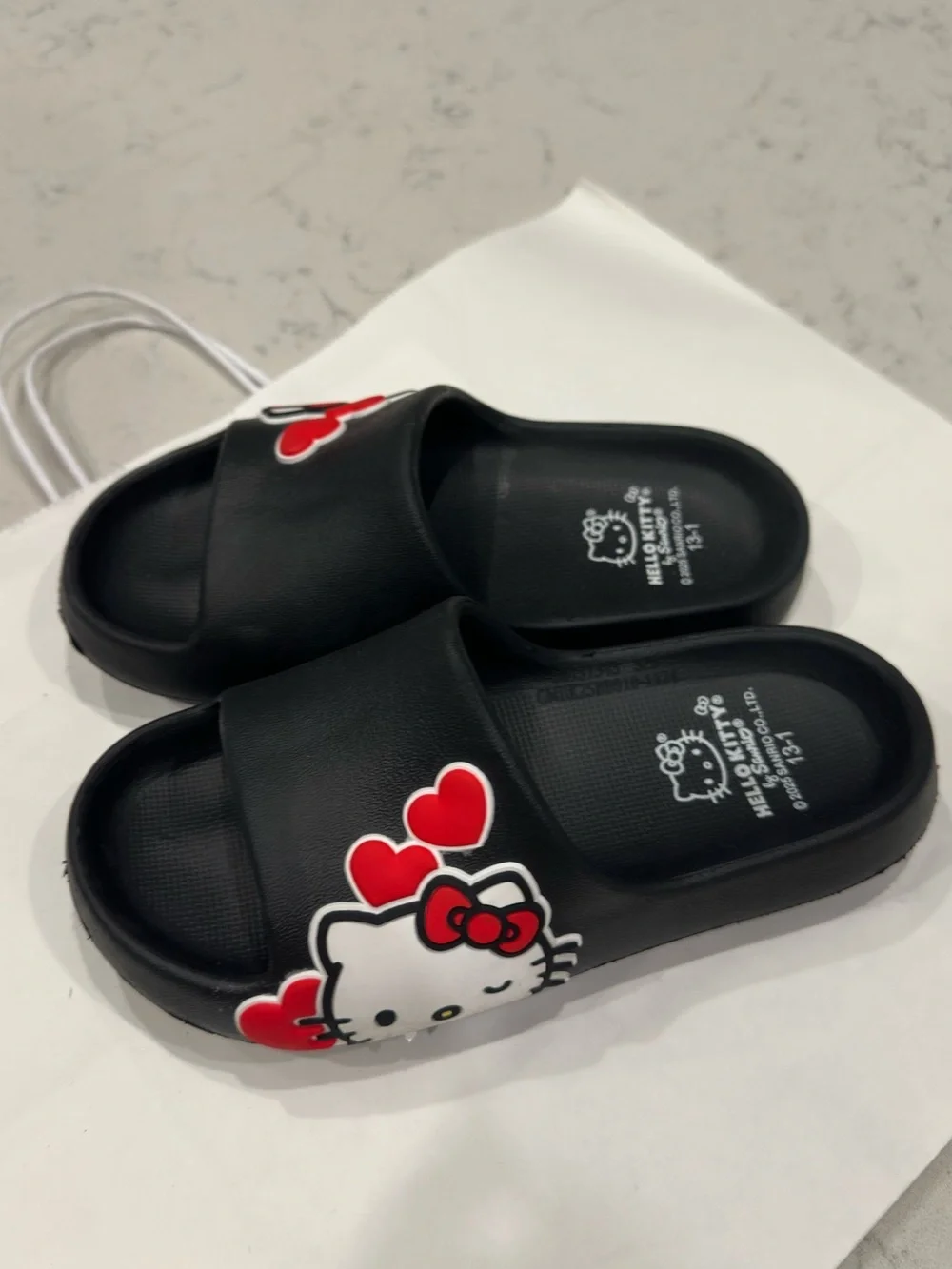 Hello Kitty Black Slide Sandals with Red Heart Accents